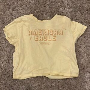 American Eagle Cream Tee with Blue Logo